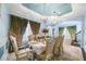 Formal dining room with ornate furniture and a statement chandelier at 9406 Dugard Ct, Orlando, FL 32827