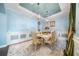 Formal dining room with ornate furniture and a statement chandelier at 9406 Dugard Ct, Orlando, FL 32827