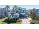 Two-story home with gray siding, blue shutters, and a paver driveway at 9406 Dugard Ct, Orlando, FL 32827
