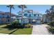 Two-story home with gray siding, blue shutters, and a paver driveway at 9406 Dugard Ct, Orlando, FL 32827