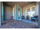 Inviting front porch with teal accents and comfortable seating at 9406 Dugard Ct, Orlando, FL 32827
