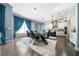 Bright kitchen with an island, white cabinets, and a view into dining area at 9406 Dugard Ct, Orlando, FL 32827