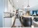 Modern kitchen with large island, stainless steel appliances, and custom cabinetry at 9406 Dugard Ct, Orlando, FL 32827
