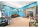Multi-purpose room with desk, seating, and access to hallway at 9406 Dugard Ct, Orlando, FL 32827