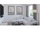 Bright living room with a sectional sofa and large windows at 2651 Candied Apple Aly, Kissimmee, FL 34744
