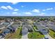 Aerial view of house and neighborhood, showcasing homes with solar panels at 524 Scenic Bluff Blvd, Lake Wales, FL 33853