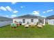 Backyard patio with seating area and solar panels at 524 Scenic Bluff Blvd, Lake Wales, FL 33853