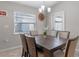 Bright dining room with a large table and access to the backyard at 524 Scenic Bluff Blvd, Lake Wales, FL 33853