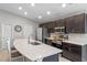 Modern kitchen with island, white countertops, and dark brown cabinets at 524 Scenic Bluff Blvd, Lake Wales, FL 33853