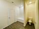 Main bathroom with a shower/tub combo and a toilet at 13489 Leaping Water Way, Astatula, FL 34705