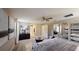 Main bedroom with a king-size bed, large mirrors, and neutral color palette at 1925 Blissful Dr, Kissimmee, FL 34744