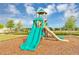 playground with two slides and wood-chip safety surface at 1943 Blissful Dr, Kissimmee, FL 34744