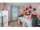 Charming bedroom with a daybed and pink accents at 3848 King Hill Dr, Haines City, FL 33844