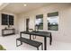 Covered patio with outdoor dining set and room for relaxing at 3848 King Hill Dr, Haines City, FL 33844