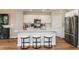 Modern kitchen with white cabinets, stainless steel appliances and an island at 3848 King Hill Dr, Haines City, FL 33844