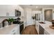 Modern kitchen with white cabinets, stainless steel appliances and an island at 3848 King Hill Dr, Haines City, FL 33844