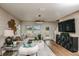 Spacious living room with sectional sofa, large TV, and wood floors at 3848 King Hill Dr, Haines City, FL 33844
