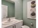 Stylish powder room with contemporary fixtures and art at 3848 King Hill Dr, Haines City, FL 33844