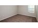 Spacious bedroom with neutral walls and carpet flooring at 1418 Derry Ave, Haines City, FL 33844