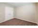 Bright bedroom featuring double doors and plush carpeting at 1418 Derry Ave, Haines City, FL 33844