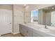 Modern bathroom with double vanity and neutral tones at 1611 Ellesmere Ave, Haines City, FL 33844