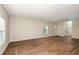 Spacious living room with hardwood floors and neutral walls at 4010 Gardenia Ave, Lake Hamilton, FL 33851