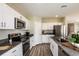 Modern kitchen with white cabinets, stainless steel appliances and an island at 4014 Gardenia Ave, Lake Hamilton, FL 33851