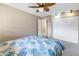 Bedroom featuring a ceiling fan, spacious closet, and ample natural light at 412 Howard Ave # C, Lakeland, FL 33815