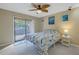 Bright bedroom with sliding glass doors leading to balcony access at 412 Howard Ave # C, Lakeland, FL 33815