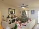 Bright living room with a large Christmas tree and a cozy atmosphere at 6421 Myrtlewood Dr, Lakeland, FL 33810