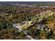 Aerial view of a house nestled within a sprawling wooded lot at 2468 Fawn Run, Oviedo, FL 32765