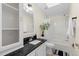 Clean bathroom with granite vanity and a bathtub at 7435 Postal Colony Rd, Clermont, FL 34714