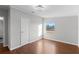 Bedroom with wood flooring, closet and window view at 7435 Postal Colony Rd, Clermont, FL 34714