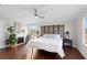 Spacious main bedroom with king-size bed, fireplace, and wood floors at 7435 Postal Colony Rd, Clermont, FL 34714