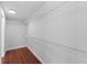 Walk-in closet with wire shelving and wood flooring at 7435 Postal Colony Rd, Clermont, FL 34714