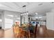 Dining room with wood floors and view of kitchen at 7435 Postal Colony Rd, Clermont, FL 34714