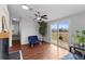 Living room with wood floors, fireplace and access to deck at 7435 Postal Colony Rd, Clermont, FL 34714