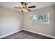 Simple bedroom with neutral walls and large window at 1030 Pineview Pl, Lakeland, FL 33801