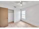 Well-lit bedroom featuring a closet and tile flooring at 3829 Abbott Ln, Lakeland, FL 33810