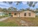 Ranch-style house with carport and mature trees at 3829 Abbott Ln, Lakeland, FL 33810