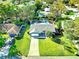 Home's aerial view showing a pool and large backyard at 4417 Orangewood W Loop, Lakeland, FL 33813