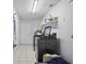 Laundry room with washer, dryer, and storage at 4417 Orangewood W Loop, Lakeland, FL 33813