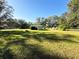 Large backyard with a shed and mature trees at 4805 Sand Mountain Loop Rd, Auburndale, FL 33823