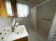Bathroom with shower, toilet, and white sink at 4805 Sand Mountain Loop Rd, Auburndale, FL 33823