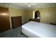 Bright bedroom with wood paneling and built-in dresser at 4805 Sand Mountain Loop Rd, Auburndale, FL 33823