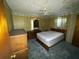 Cozy bedroom with wood paneling, ceiling fan, and ample closet space at 4805 Sand Mountain Loop Rd, Auburndale, FL 33823