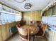 Small dining area with a round wooden table and four chairs at 4805 Sand Mountain Loop Rd, Auburndale, FL 33823