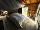 Bright garage with car covered and items stored at 4805 Sand Mountain Loop Rd, Auburndale, FL 33823