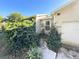 House exterior showcasing the front entrance and landscaping at 4805 Sand Mountain Loop Rd, Auburndale, FL 33823