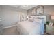 Spacious bedroom with plush bedding and en-suite bathroom access at 5340 Spoonflower Ct, St Cloud, FL 34771